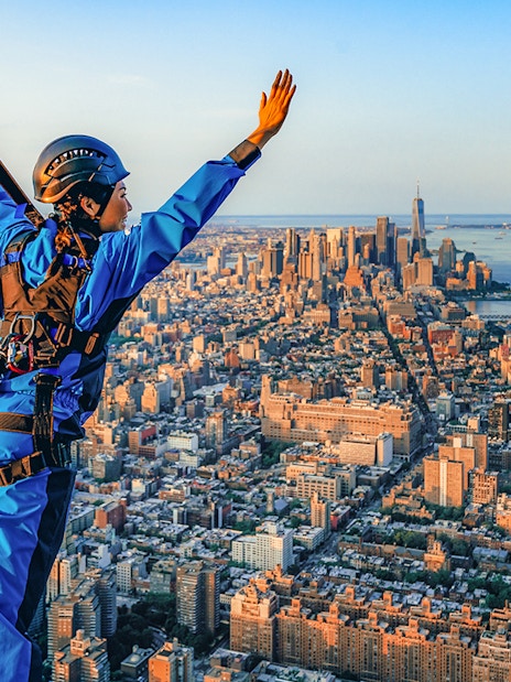Person in harness enjoying view from skyscraper in New York City with Edge Express Pass.