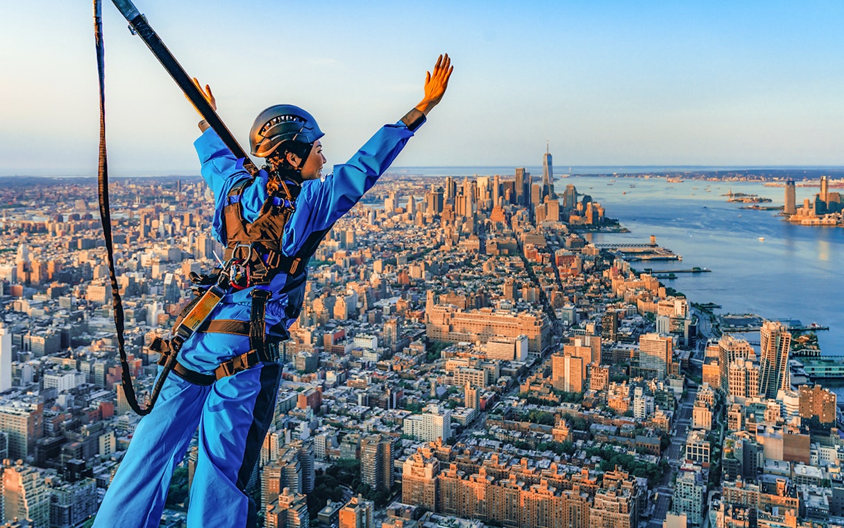 Person in harness enjoying view from skyscraper in New York City with Edge Express Pass.