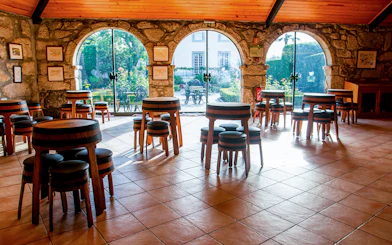 Tasting room with barrel tables at Taylor's Port Cellars in Porto.