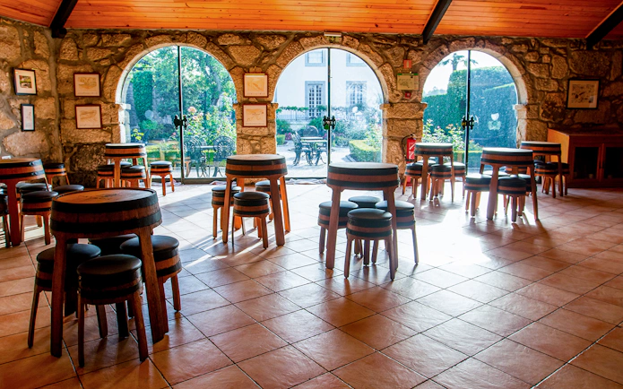 Tasting room with barrel tables at Taylor's Port Cellars in Porto.