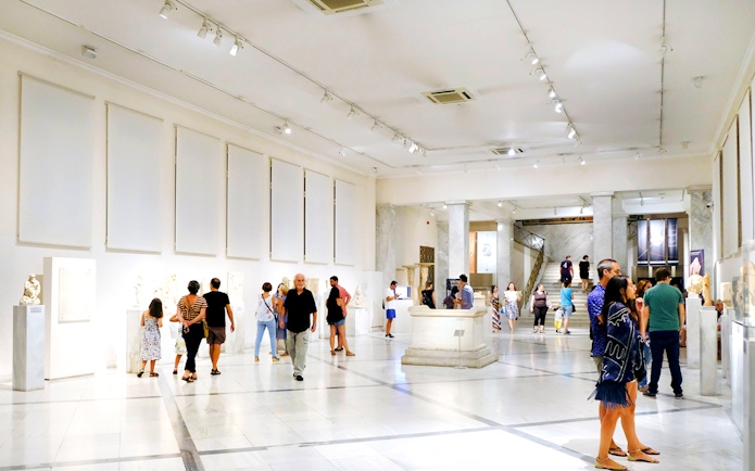 Visitors exploring exhibits at Athens National Archaeological Museum.