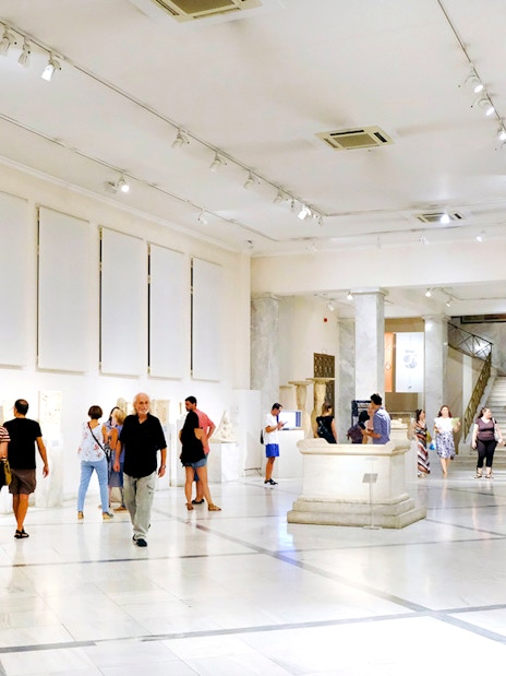 Visitors exploring exhibits at Athens National Archaeological Museum.