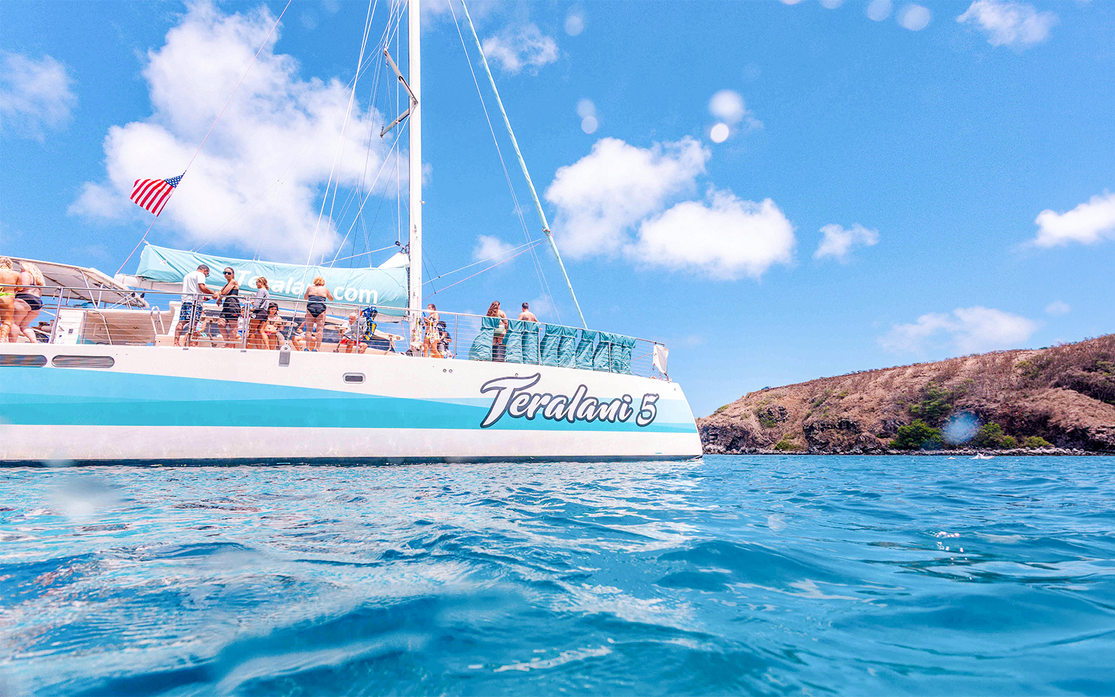Luxury sailboat with tourists on a snorkel tour in Maui, Hawaii.