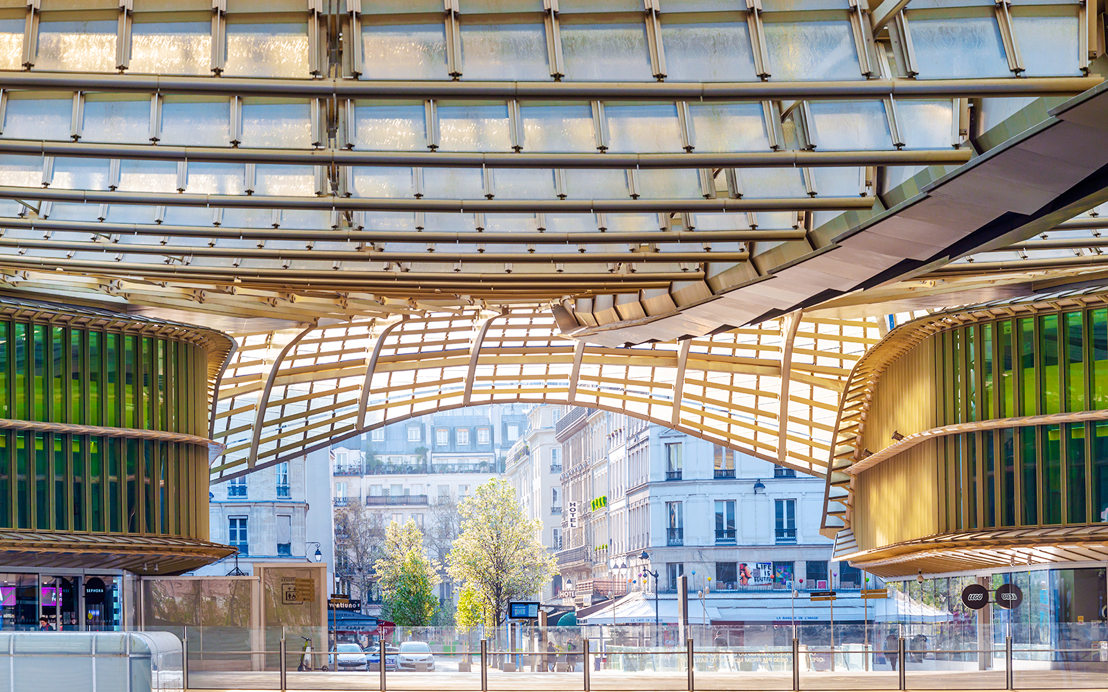 Forum des Halles canopy with surrounding Parisian architecture in the background.