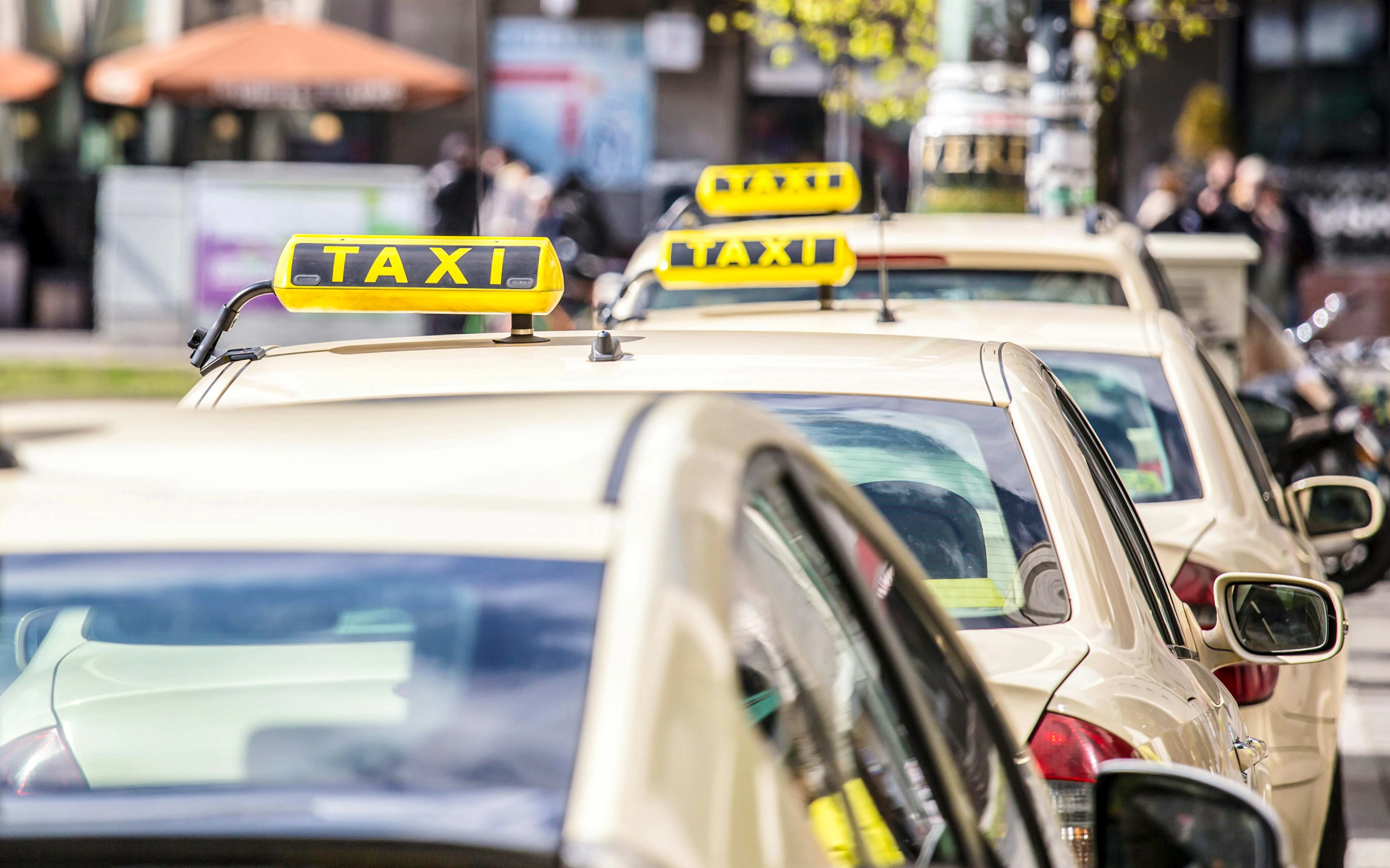 Taxis lined up near 3-2-1 Qatar Olympic and Sports Museum for visitor transportation.