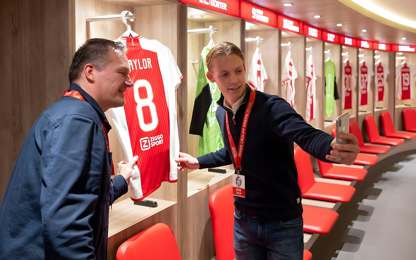 Visitors taking a selfie in the Johan Cruijff ArenA locker room during the Classic Tour.