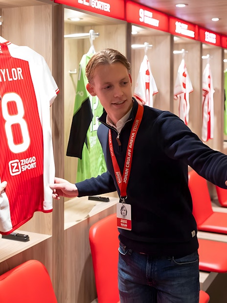 Visitors taking a selfie in the Johan Cruijff ArenA locker room during the Classic Tour.