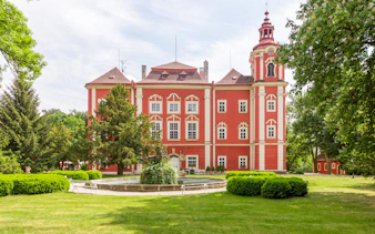 Detenice Castle exterior with gardens in Prague.