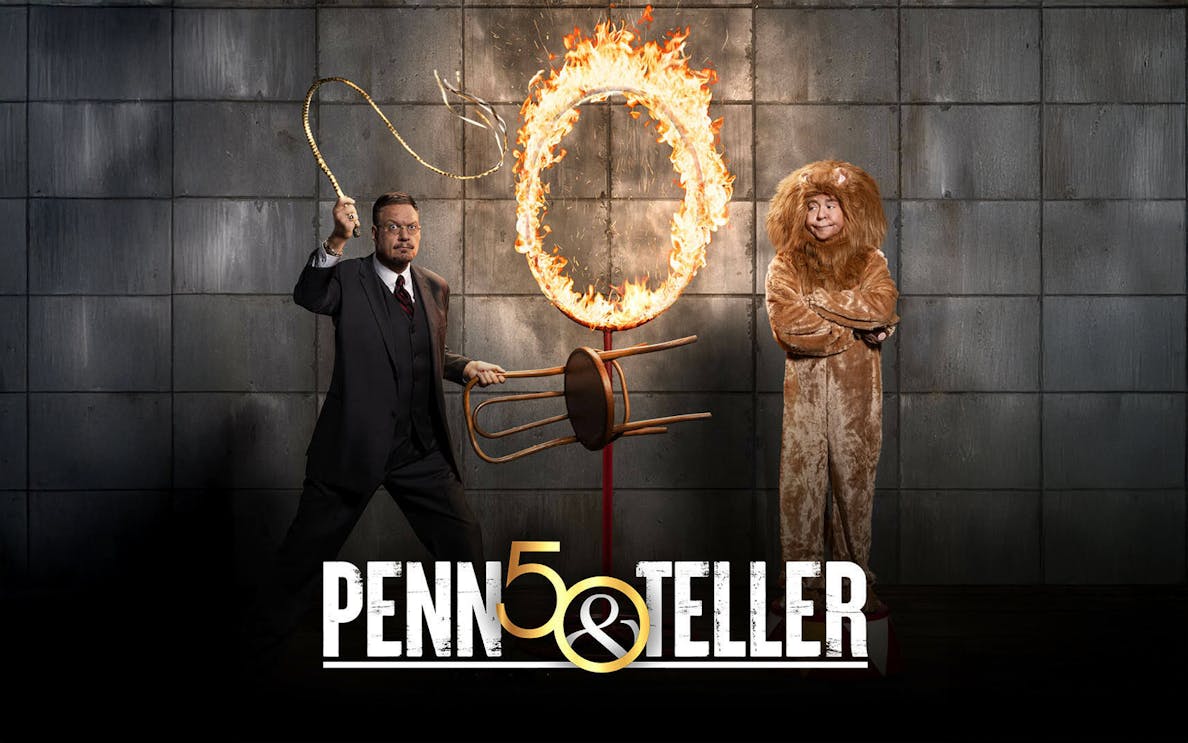 Penn & Teller poster with a flaming hoop and a person in a lion costume.