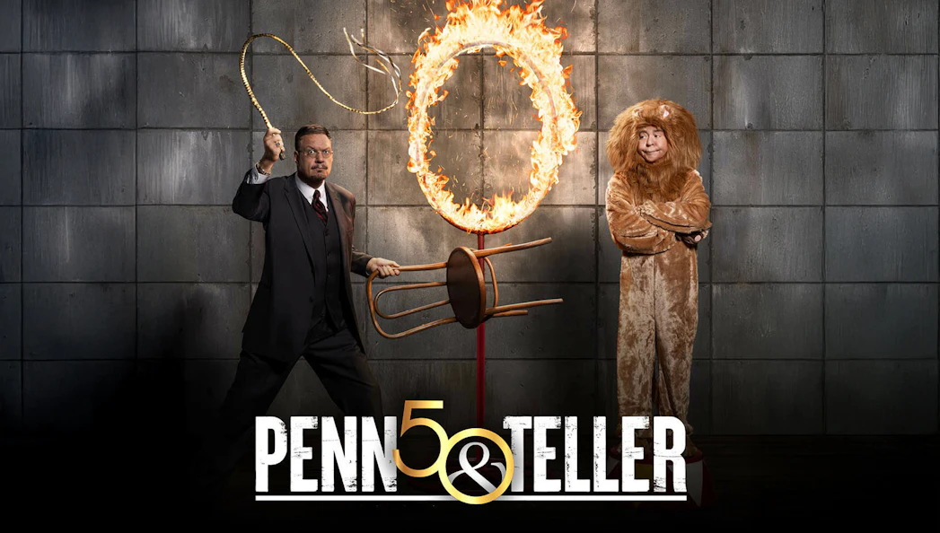 Penn & Teller poster with a flaming hoop and a person in a lion costume.