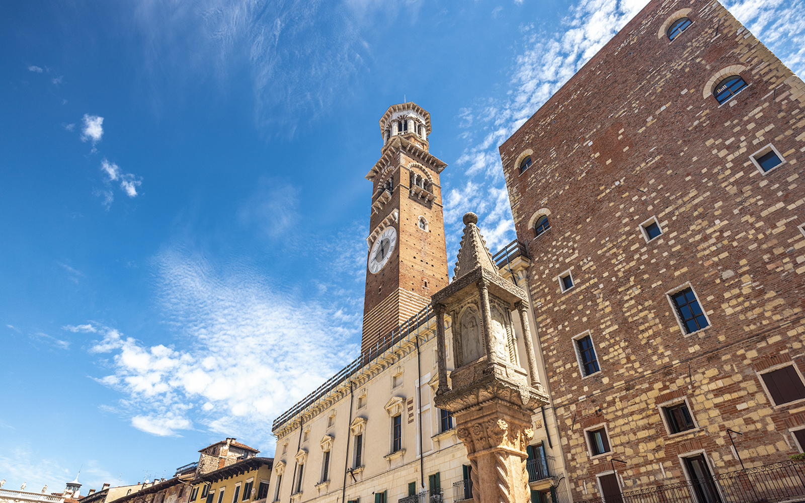 Lamberti Tower in Verona with clear blue sky.