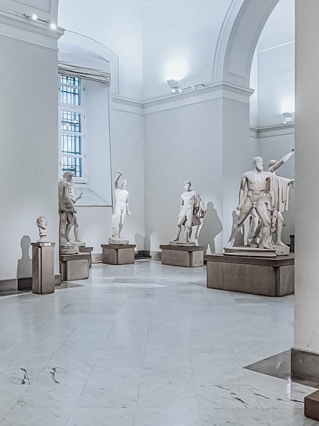 Statues in a gallery at Naples National Archaeological Museum.