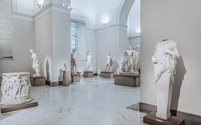 Statues in a gallery at Naples National Archaeological Museum.