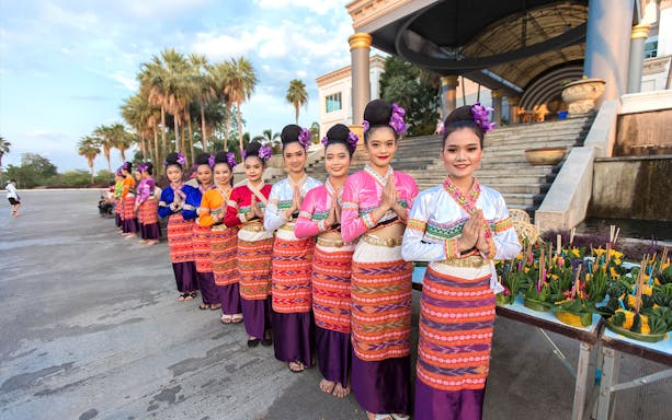 Traditional dancers in colorful attire at Yeepeng Lanna Festival 2023, Chiang Mai.
