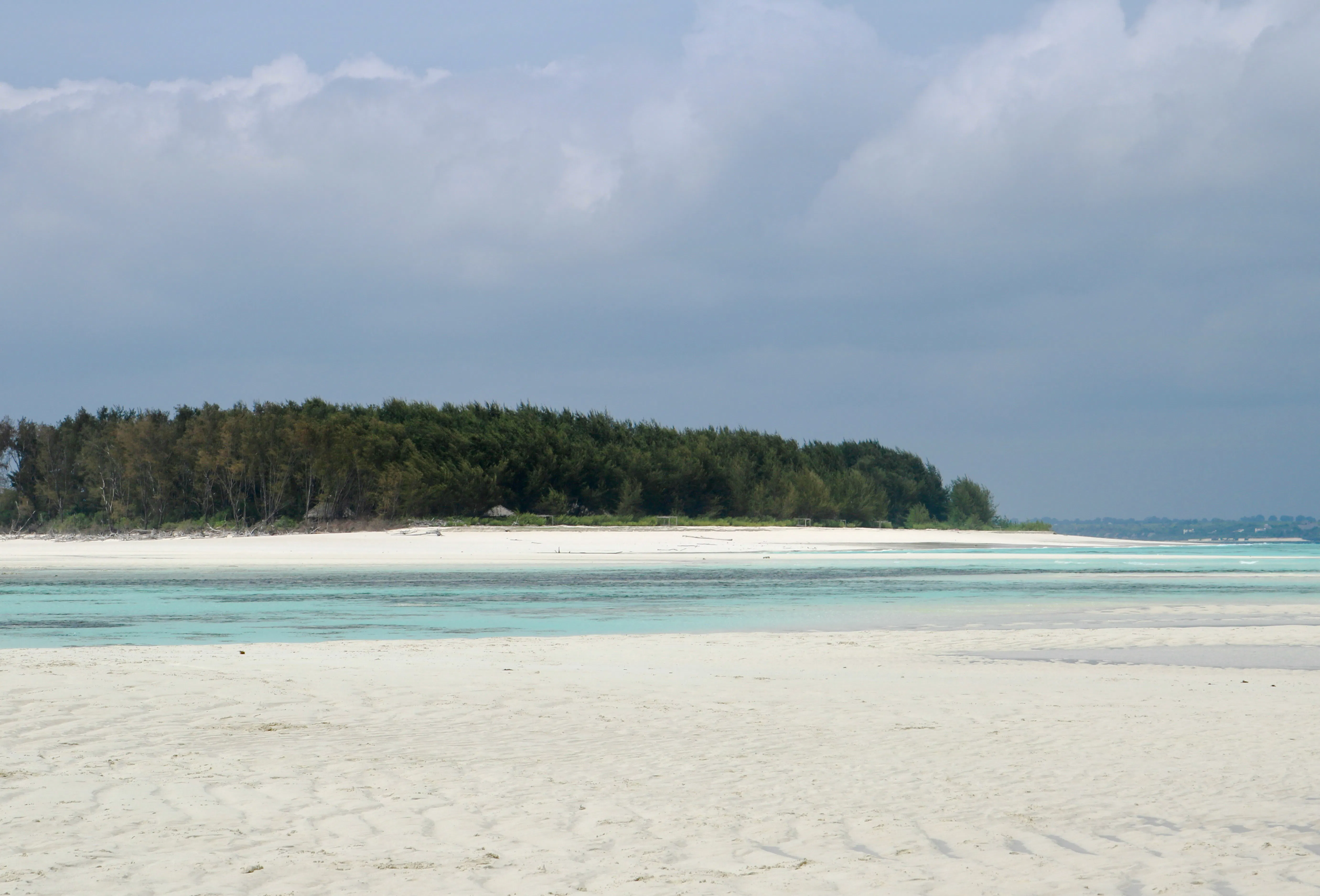 Mnemba Island Atoll beach with turquoise waters, Zanzibar.
