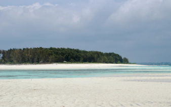 Mnemba Island Atoll beach with turquoise waters, Zanzibar.