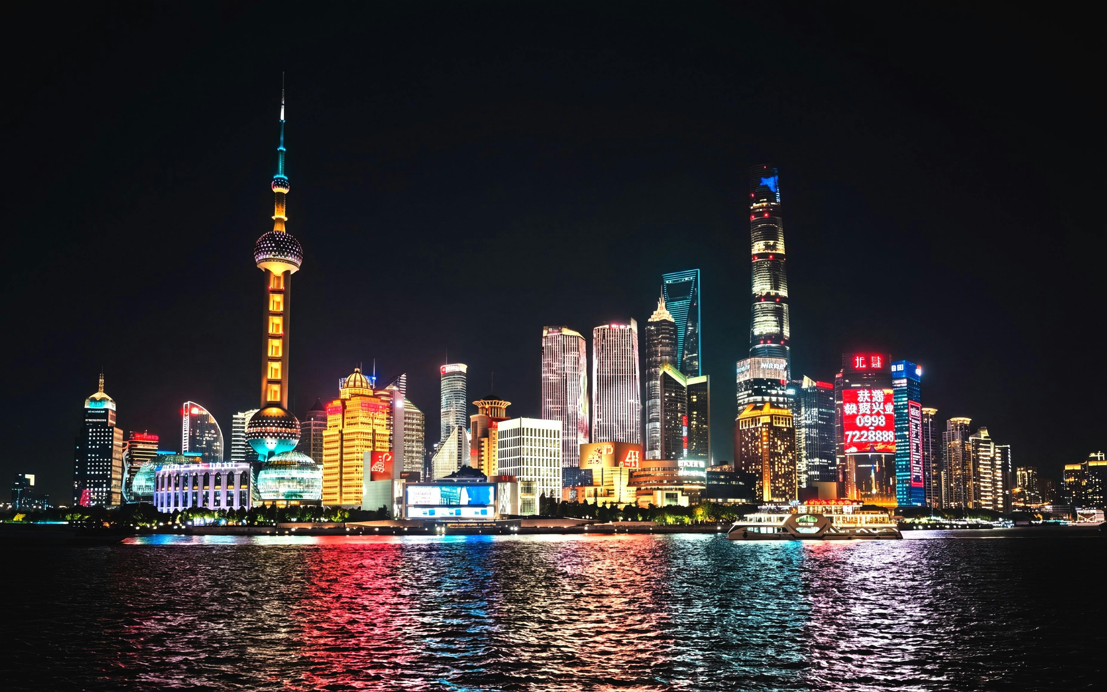 Lujiazui financial district skyline at night, viewed from The Bund, Shanghai, China.