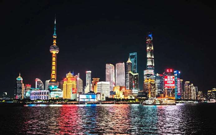 Lujiazui financial district skyline at night, viewed from The Bund, Shanghai, China.