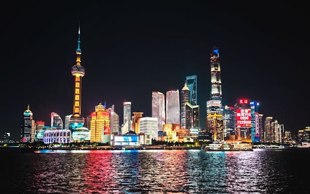 Lujiazui financial district skyline at night, viewed from The Bund, Shanghai, China.
