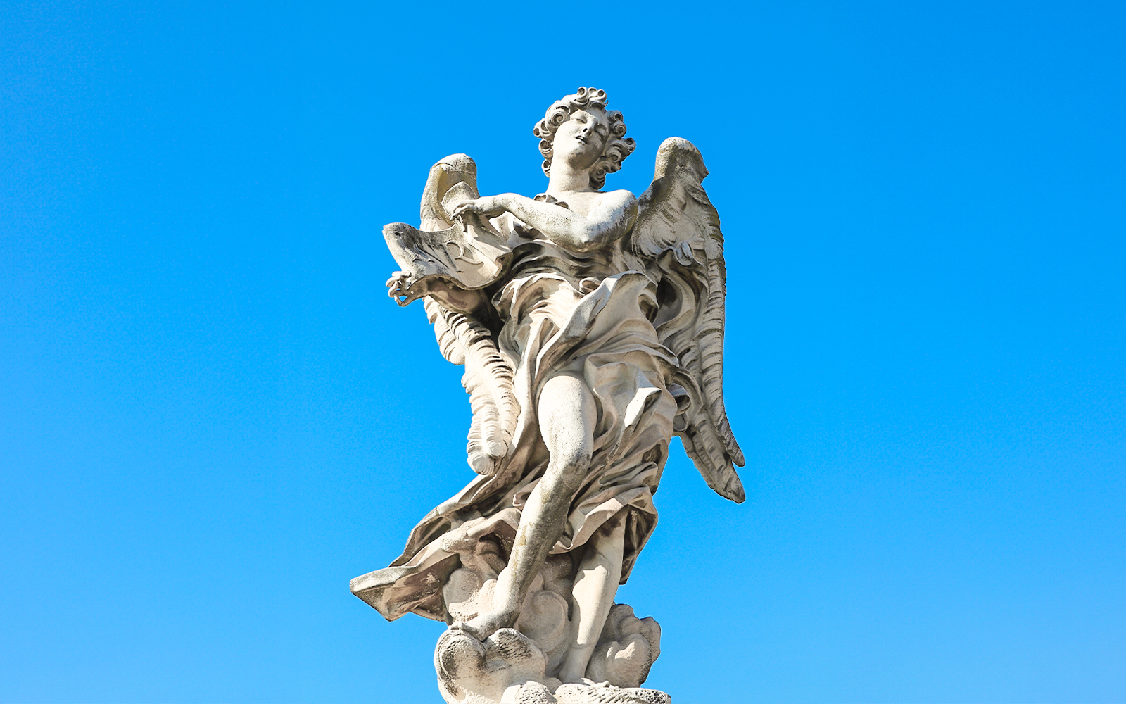 Angel with Superscription statue on Ponte Sant'Angelo Bridge, Rome, Italy.