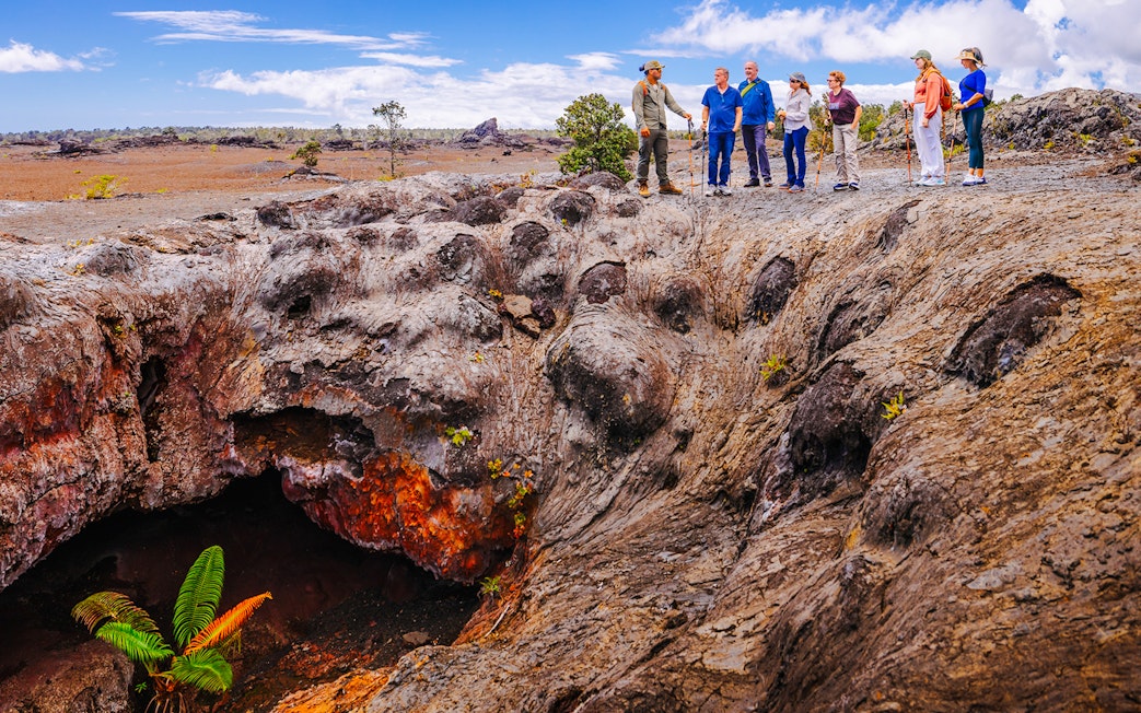 Guests exploring volcanic terrain on Hawaii adventure tour.