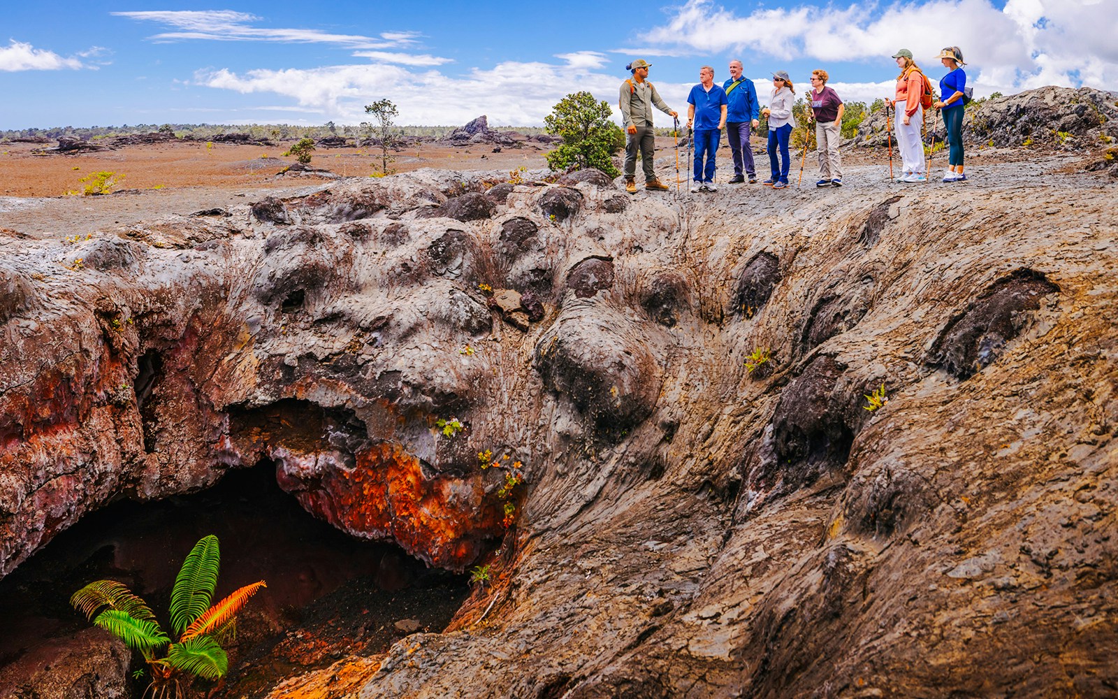 Guests exploring volcanic terrain on Hawaii adventure tour.