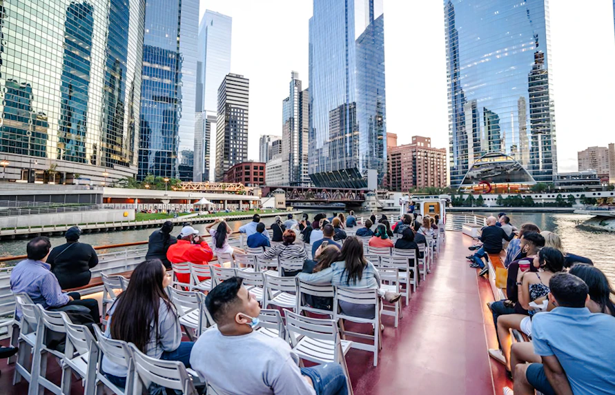 People enjoying a 30-minute Lake Michigan skyline cruise with Chicago skyscrapers in view.