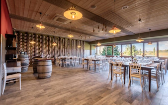 Winery tasting room with tables set for a Chianti tour from Florence.