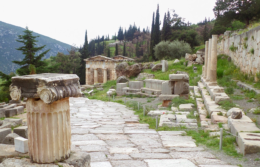 Ancient ruins along the Sacred Way at Delphi Archaeological Site, Greece.