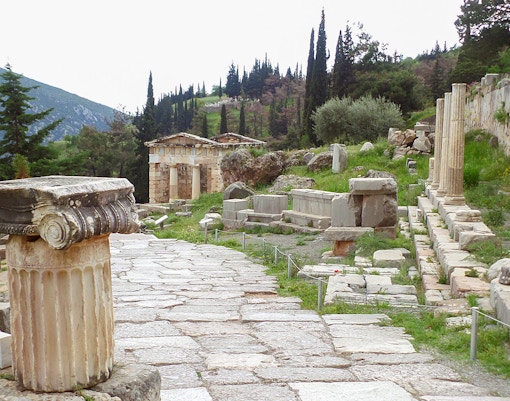 Ancient ruins along the Sacred Way at Delphi Archaeological Site, Greece.