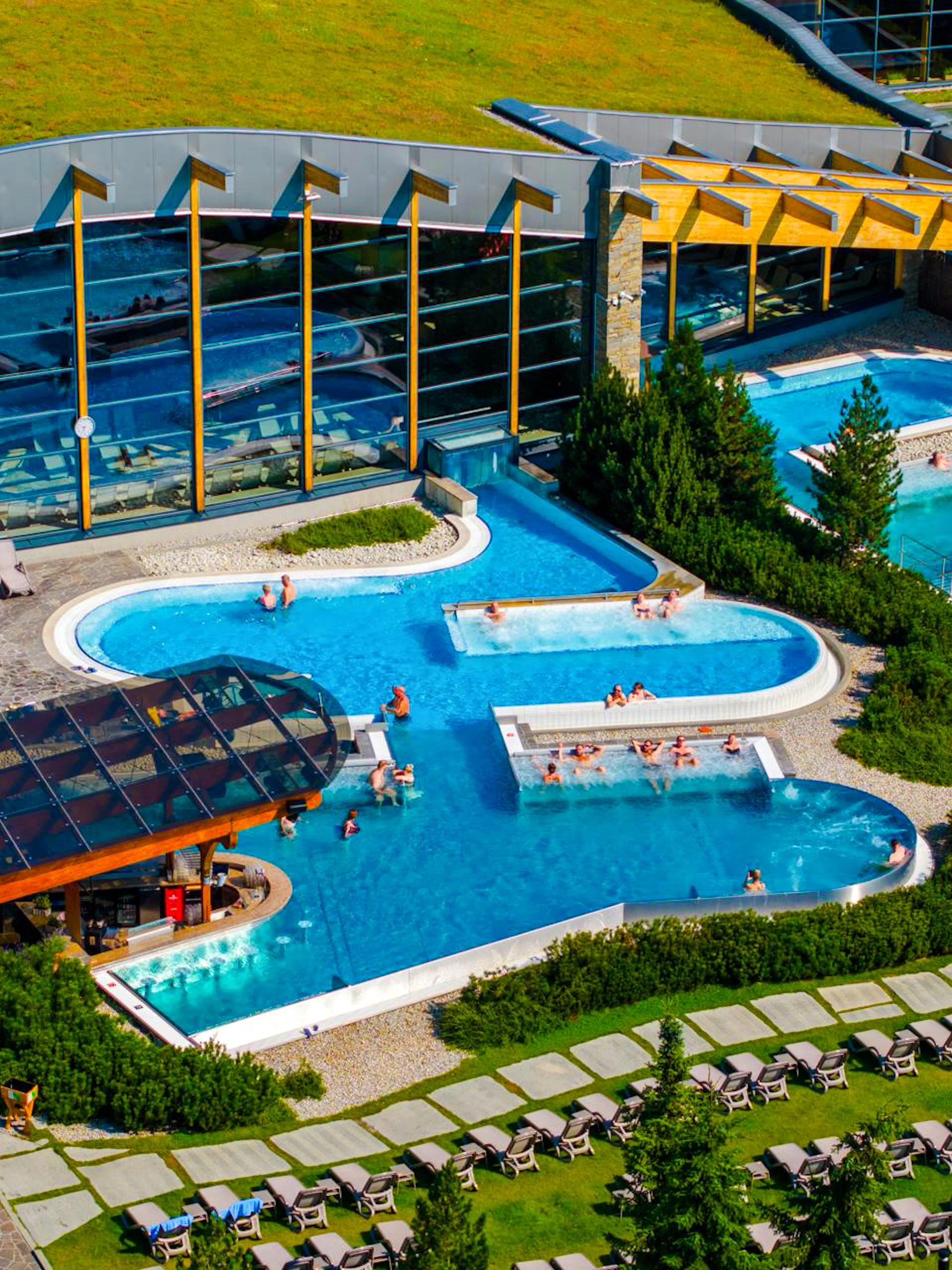 Guests relaxing in outdoor pools at Terma Bania, Zakopane.