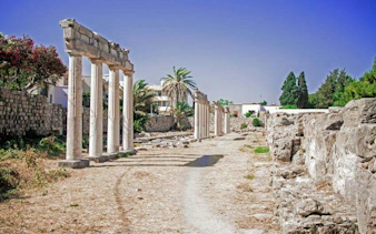 Ancient ruins of Asclepieion at Kos with stone columns and pathway, Rhodes.