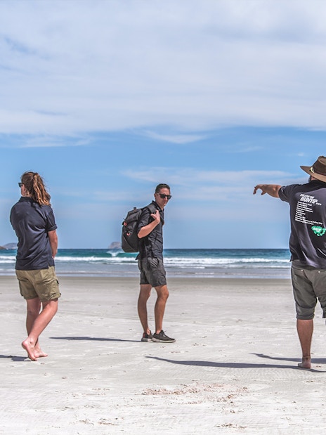Group walking on a beach during Wilsons Promontory guided tour.