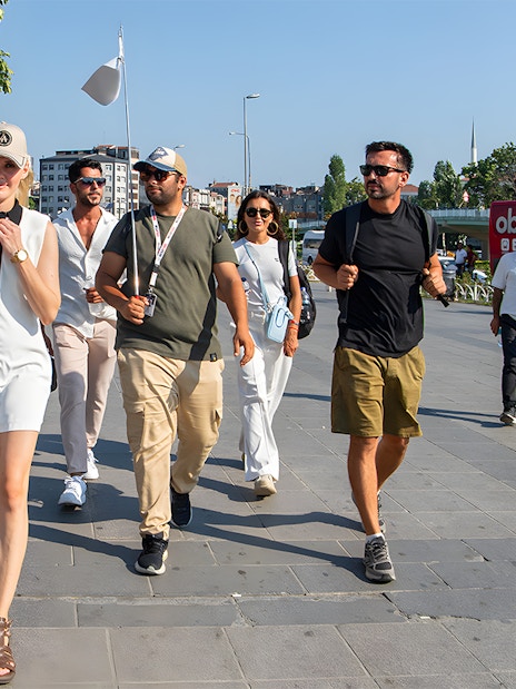 Tour guide leading a group of tourists on a walking tour in Istanbul.