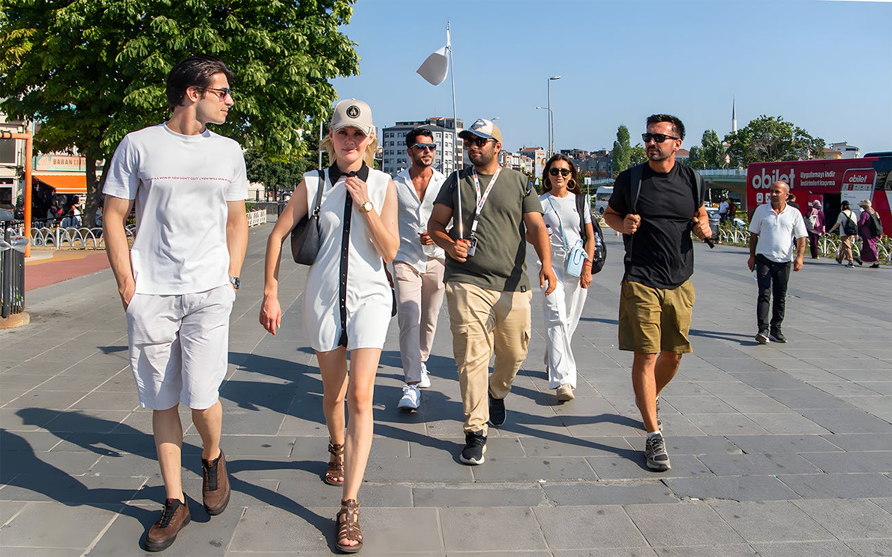 Tour guide leading a group of tourists on a walking tour in Istanbul.