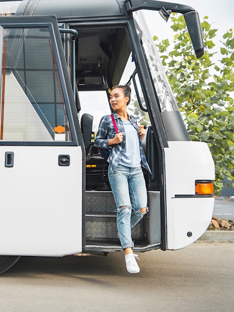 Tourist boarding coach at Tirana airport for Adventure Waterpark Desaru trip.