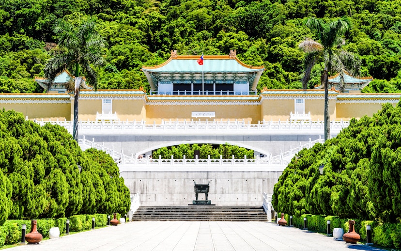 Taiwan National Palace Museum entrance with lush greenery in Taipei, Taiwan.