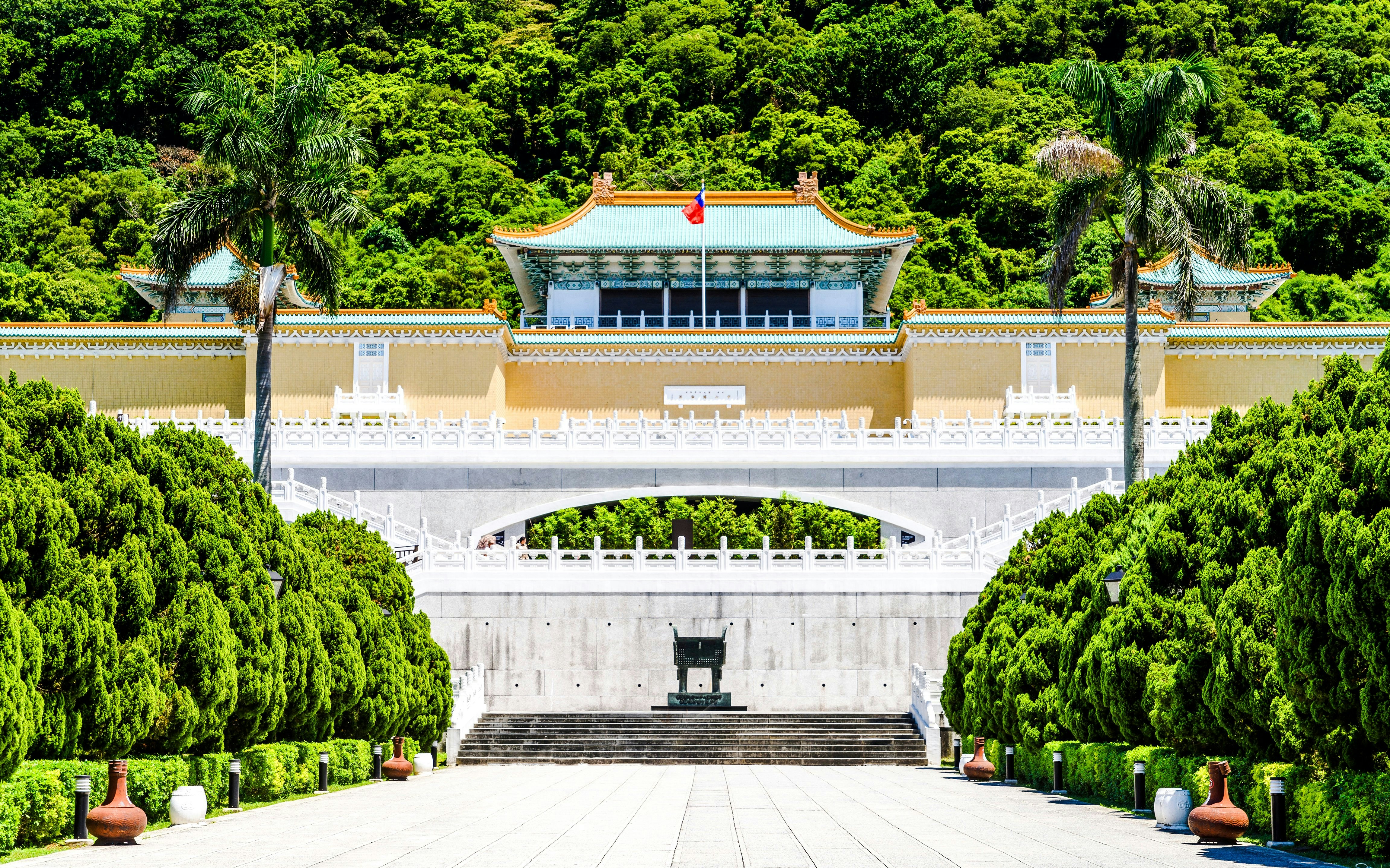 Taiwan National Palace Museum entrance with lush greenery in Taipei, Taiwan.