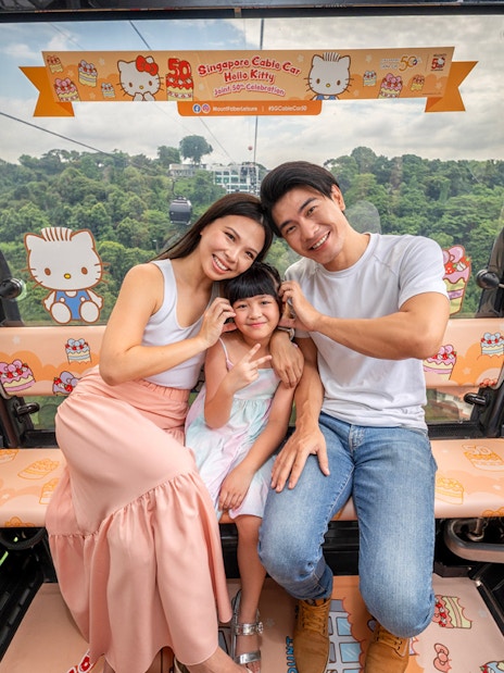 Family enjoying Singapore Cable Car with Hello Kitty theme.