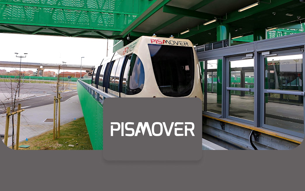 Pisamover train at station for round-trip tickets between airport and city.
