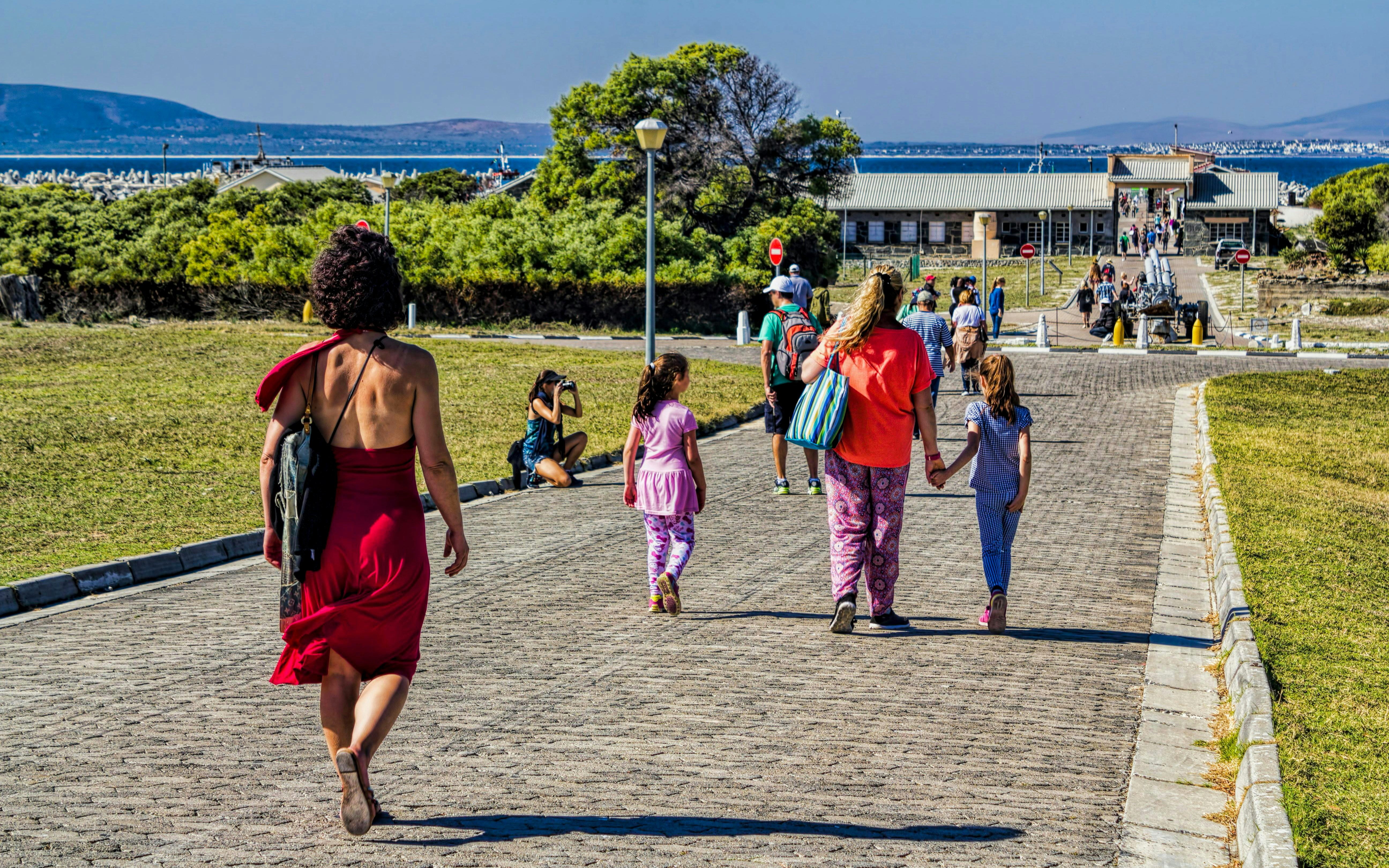 Visitors walking towards Robben Island prison entrance in South Africa.