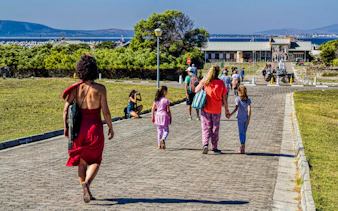 Visitors walking towards Robben Island prison entrance in South Africa.