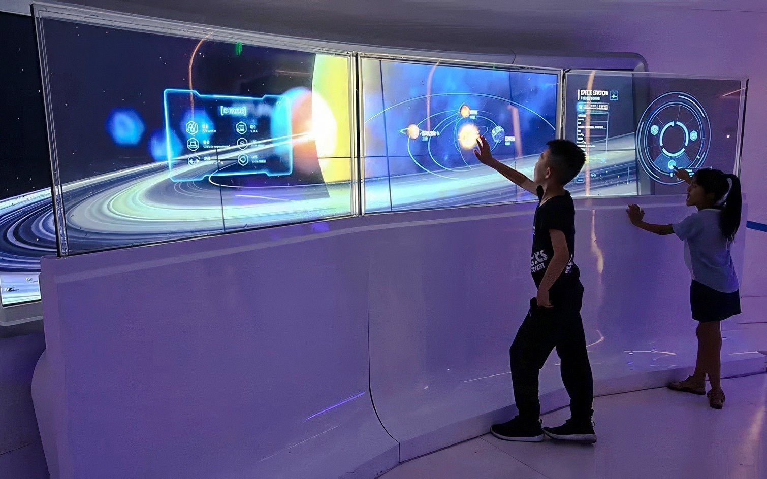 Children engaging with space exhibit at Oriental Pearl Tower, Shanghai.