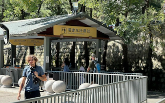 Shuttle bus ticket check area at Mutianyu Great Wall entrance.