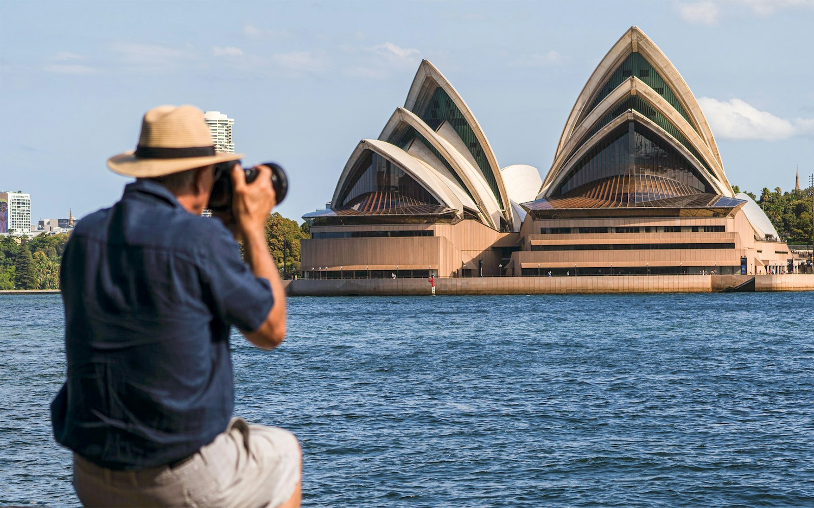 Man photographing the petlals of the Opera House in Sydney