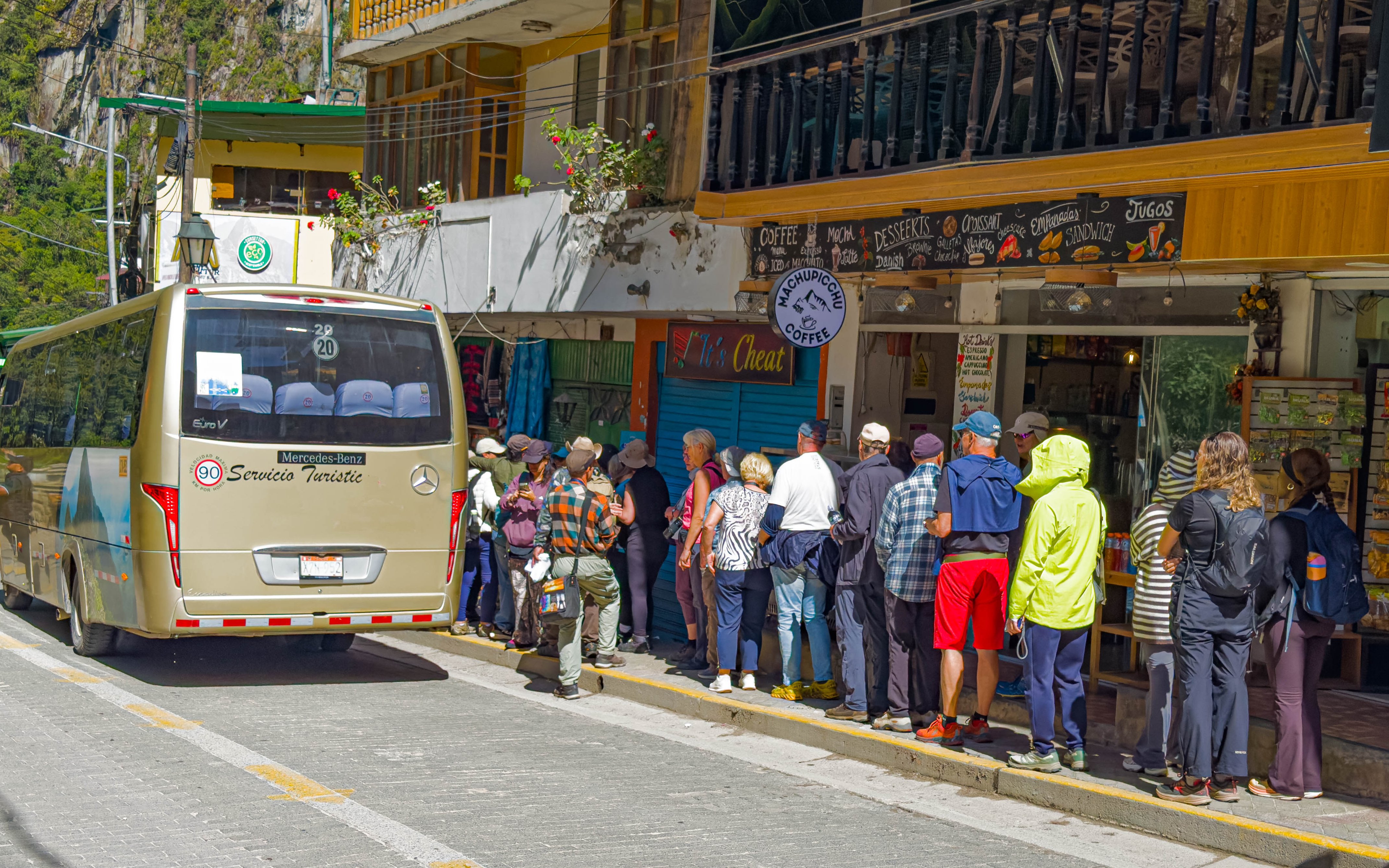 Tourists lining up to board a bus to Machu Picchu, Peru.
