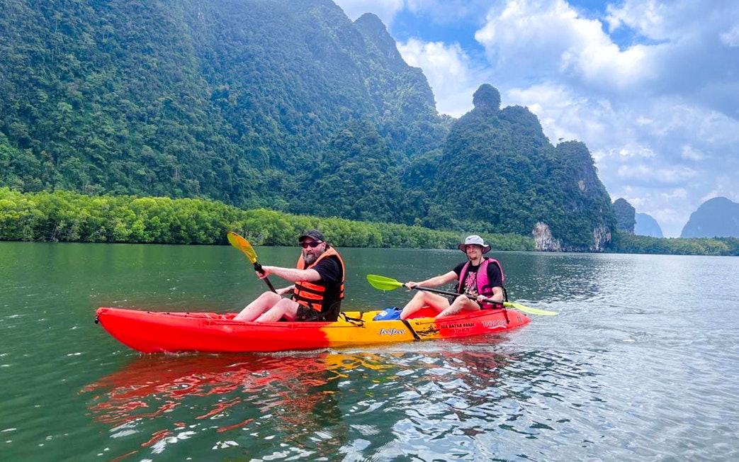 Tourists kayaking at Ao Thalane through mangrove forests in Thailand.