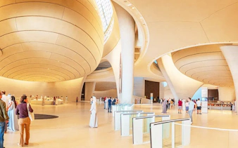 Zayed National Museum interior with visitors in Abu Dhabi.