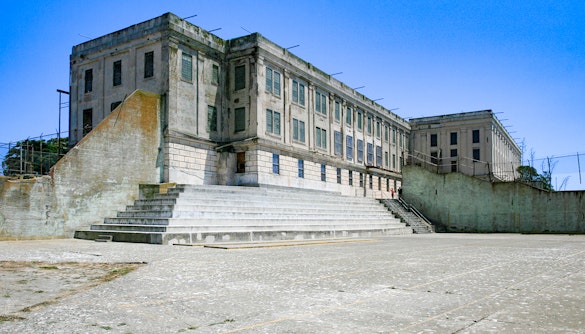 Alcatraz Island Recreation Yard with prison building, San Francisco, USA.