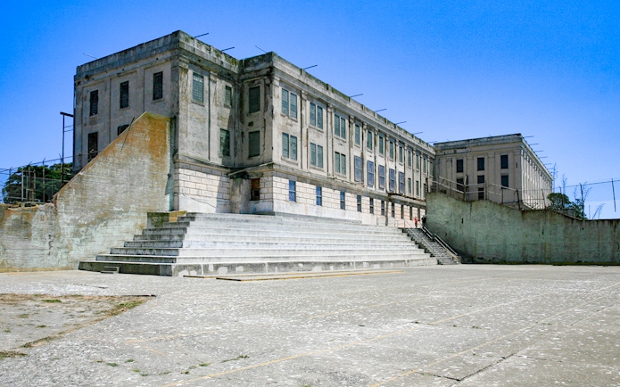 Alcatraz Island Recreation Yard with prison building, San Francisco, USA.
